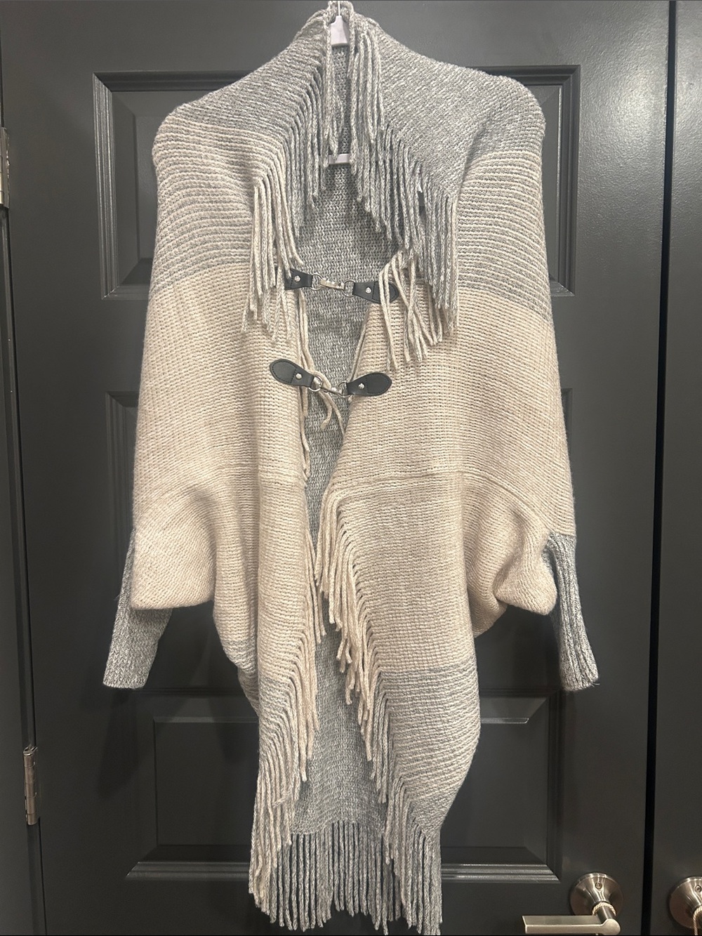 Fringed Two-Tone Knit Poncho Wrap in Gray and Cream with sleeve. Fits M-XL